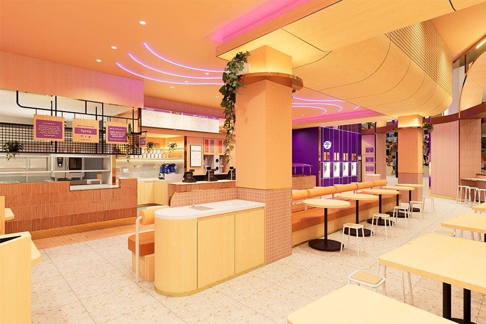 YOMG store interior — painted columns, ceiling and feature walls in warm peach and purple