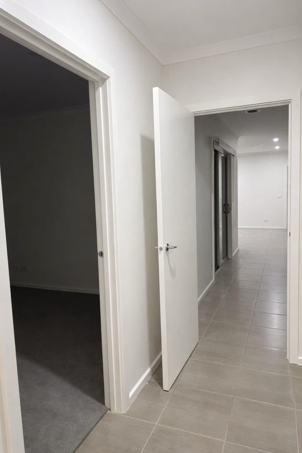 After — freshly painted VIC hallway with bright white walls, doors and trims by VD Painting