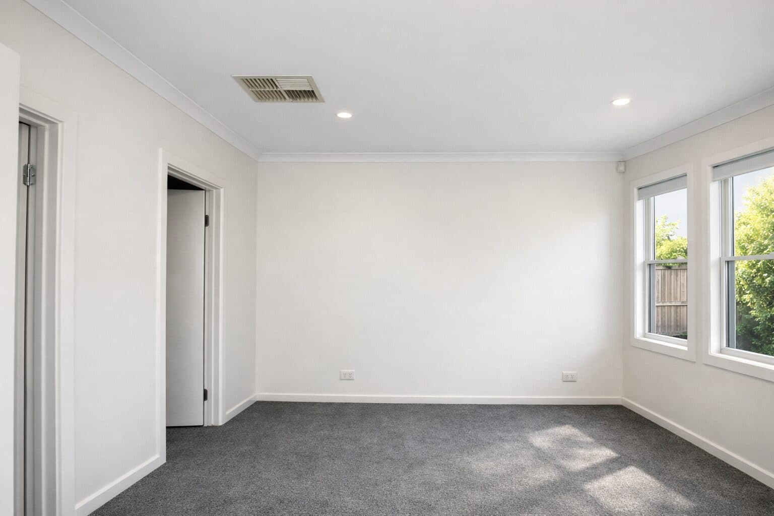 After — freshly painted VIC living room with clean white walls, ceiling and trims by VD Painting