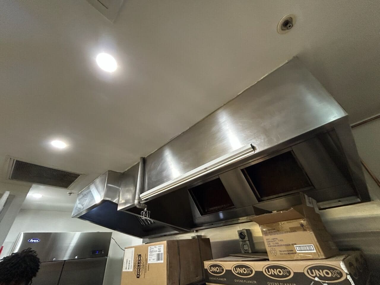 Sandwich Chefs back-of-house kitchen with freshly painted white ceiling around the stainless steel exhaust canopy by VD Painting